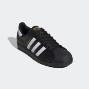 ADIDAS ORIGINALS Matalavartiset tennarit 'Superstar'  kulta / musta / ...