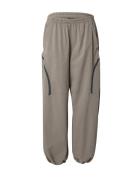 UNDER ARMOUR Housut 'Unstoppable'  taupe / musta