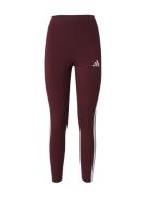ADIDAS SPORTSWEAR Urheiluhousut 'Essentials'  rubiininpunainen / offwh...