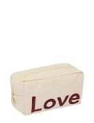 Cavita. Travel Wash Bag Cream Design Letters