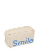 Cavita. Travel Wash Bag Cream Design Letters