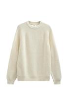 Aksune Patent Knit Cream Anerkjendt