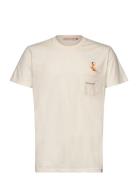 Application T-Shirt Tops T-shirts Short-sleeved Cream Revolution
