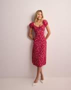 Nelly - Kukallinen - Flirty Midi Dress